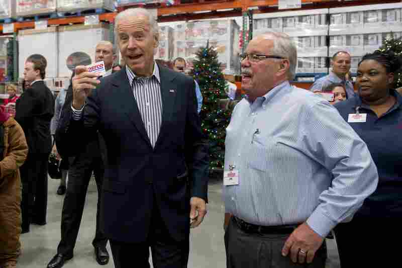 The vice president came prepared with his Costco card. At right: Costco co-founder Jim Sinegal.
