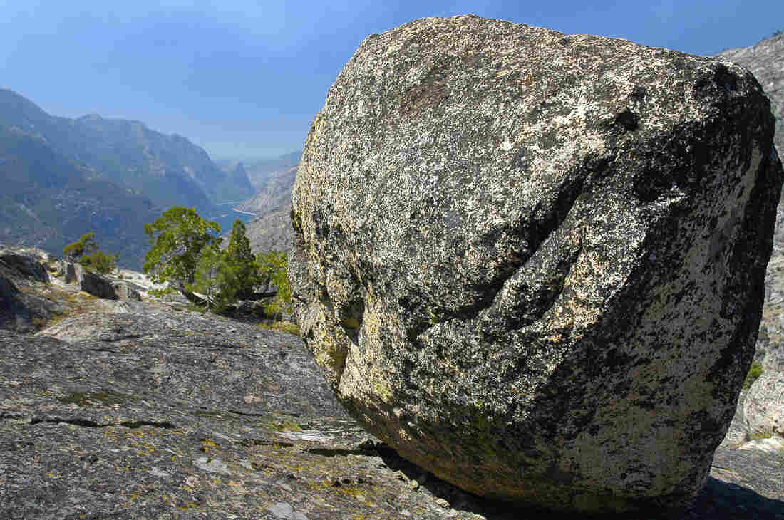A glacial erratic with the Hetch-Hetchy Reservoir in the background.