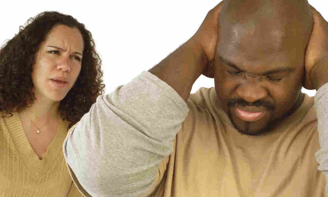 Husband and wife arguing.