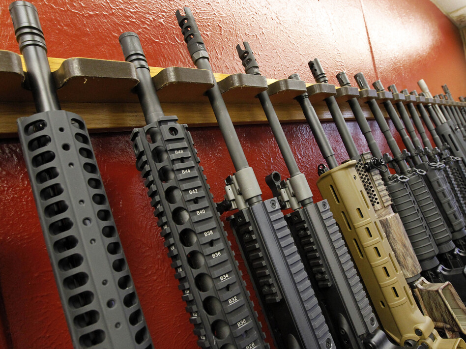 Rifles are displayed for sale at a gun shop in Aurora, Colo., in July. Gun makers are feeling isolated by changing public attitudes. (Alex Brandon/AP)
