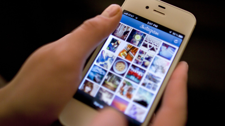 Instagram was the target of a storm of outrage on Twitter and other sites after the company announced a change in its user agreement that hinted that it might use shared photos in ads. (Karly Domb Sadof/AP)