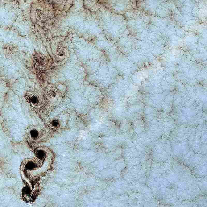 Von Kármán Vortices, Southern Pacific Ocean, 1999Swirling clouds line up in a formation known as a von Kármán street. They appear when wind-driven clouds encounter an obstacle, in this instance Alexander Selkirk Island in the southern Pacific Ocean.