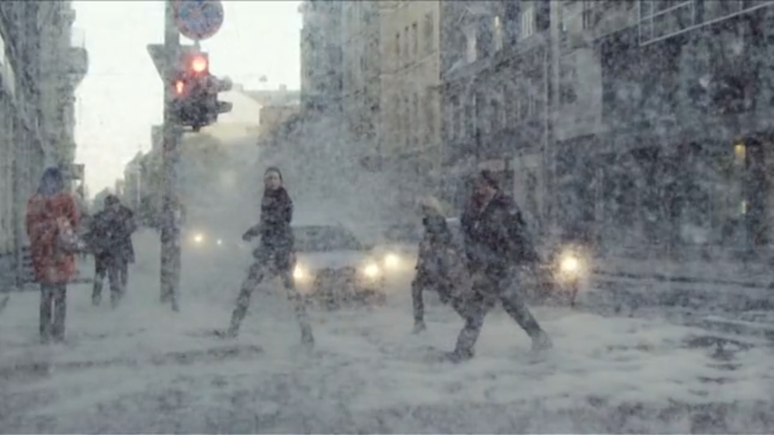 Pollen-producing cattail seeds were dumped onto busy downtown Riga, creating a spectacle of imaginative snowy wonderland.