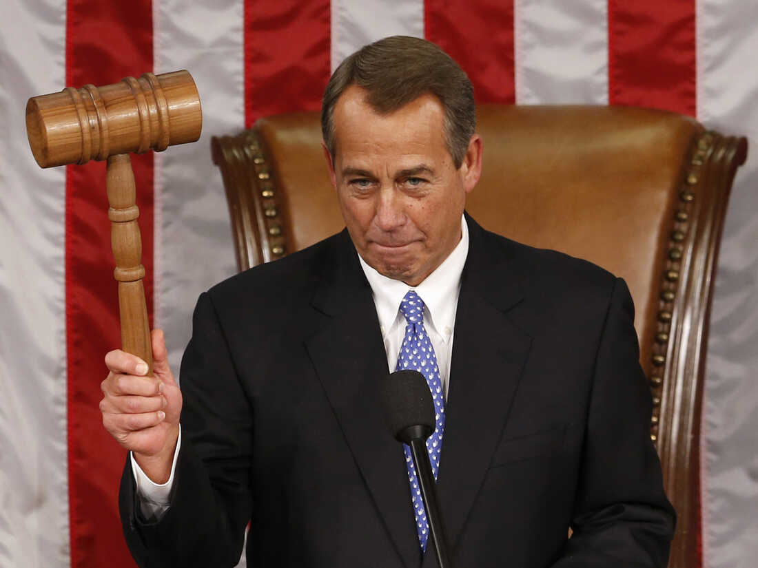 House Speaker John Boehner holds up the gavel after being re-elected on the first day of the 113th Congress.