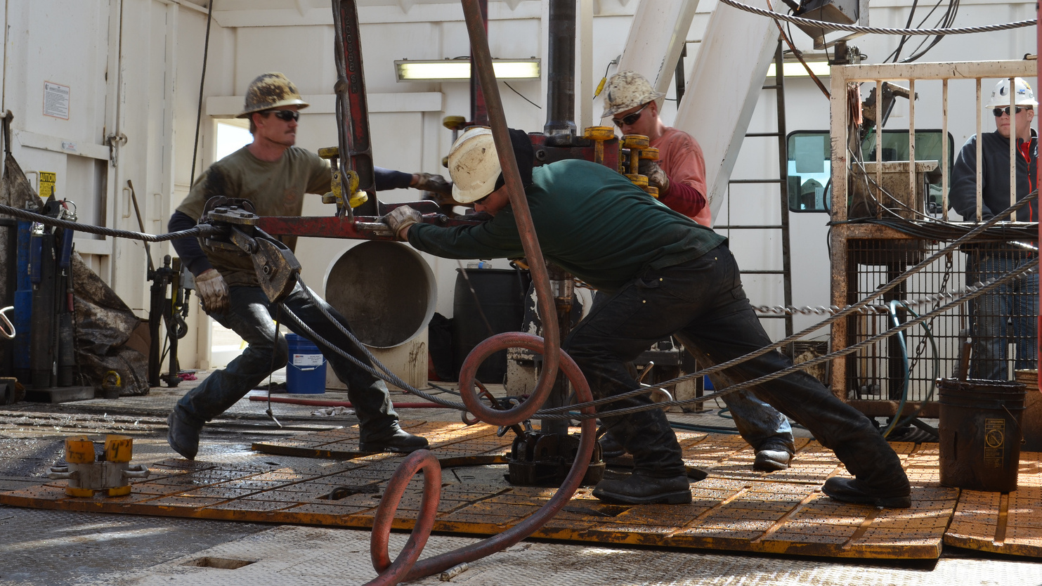 Men hard at work in oil-booming North Dakota. (Todd Melby)