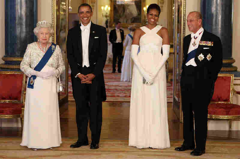 Diplomacy with style: The Obamas pose with Queen Elizabeth II and Prince Philip at Buckingham Palace ahead of a state banquet on May 24, 2011. Michelle's gown was designed by American fashion designer Tom Ford.