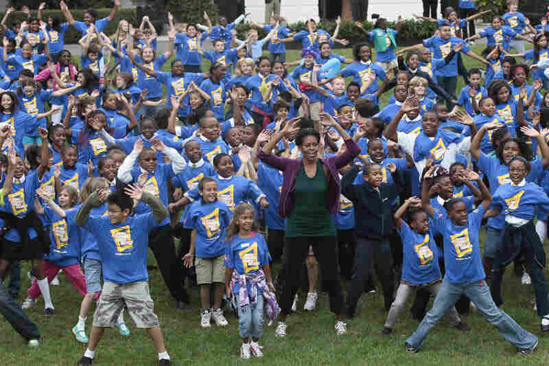 Let's move: Michelle and a group of children try to break the Guinness World Record for the most people doing jumping jacks in a 24-hour period, at the White House on Oct. 11, 2011. Michelle's anti-obesity campaign, Let's Move, focuses on teaching children good nutrition and regular exercise.