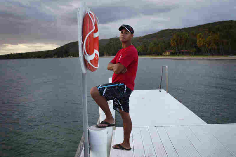 Edward Bonet, 23, lives in Cabo Rojo, Puerto Rico, and works on the dive team at the Copamarina Beach Resort & Spa in the town of Guanica. He lives with his grandmother, Genoveva "Veva" Camacho. 