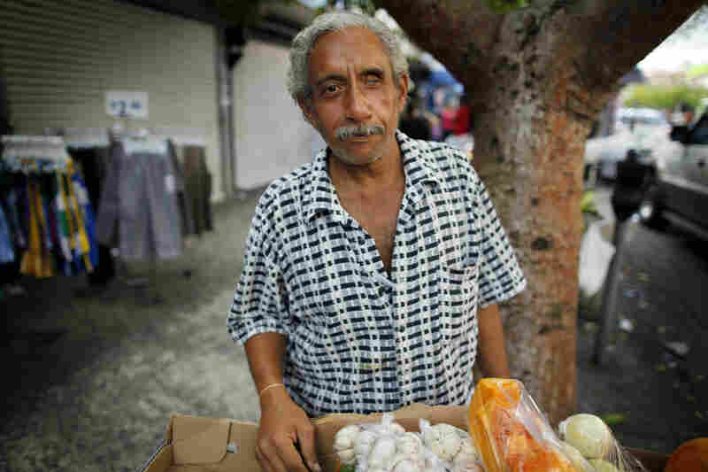 Miguel Sanchez sells fruits and vegetables on the street in Rio Piedras. 
