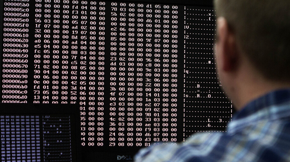 An analyst looks at code in the malware lab of a cybersecurity defense lab at the Idaho National Laboratory in Idaho Falls, Idaho, Sept. 29, 2011. (Jim Urquhart/Reuters/Landov)
