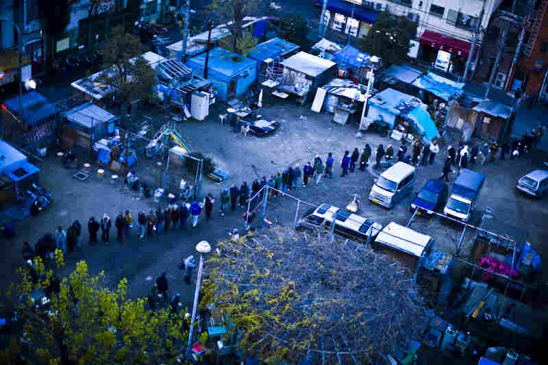 Chapter 1: Dumping Ground of Old Men in Japan — End Of Labor Town. People wait in line to receive a charity meal in Kamagasaki, Osaka, Japan. Once a thriving day laborer's town, Kamagasaki is now home to about 25,000 mainly elderly day laborers, with an estimated 1,300 who are homeless.