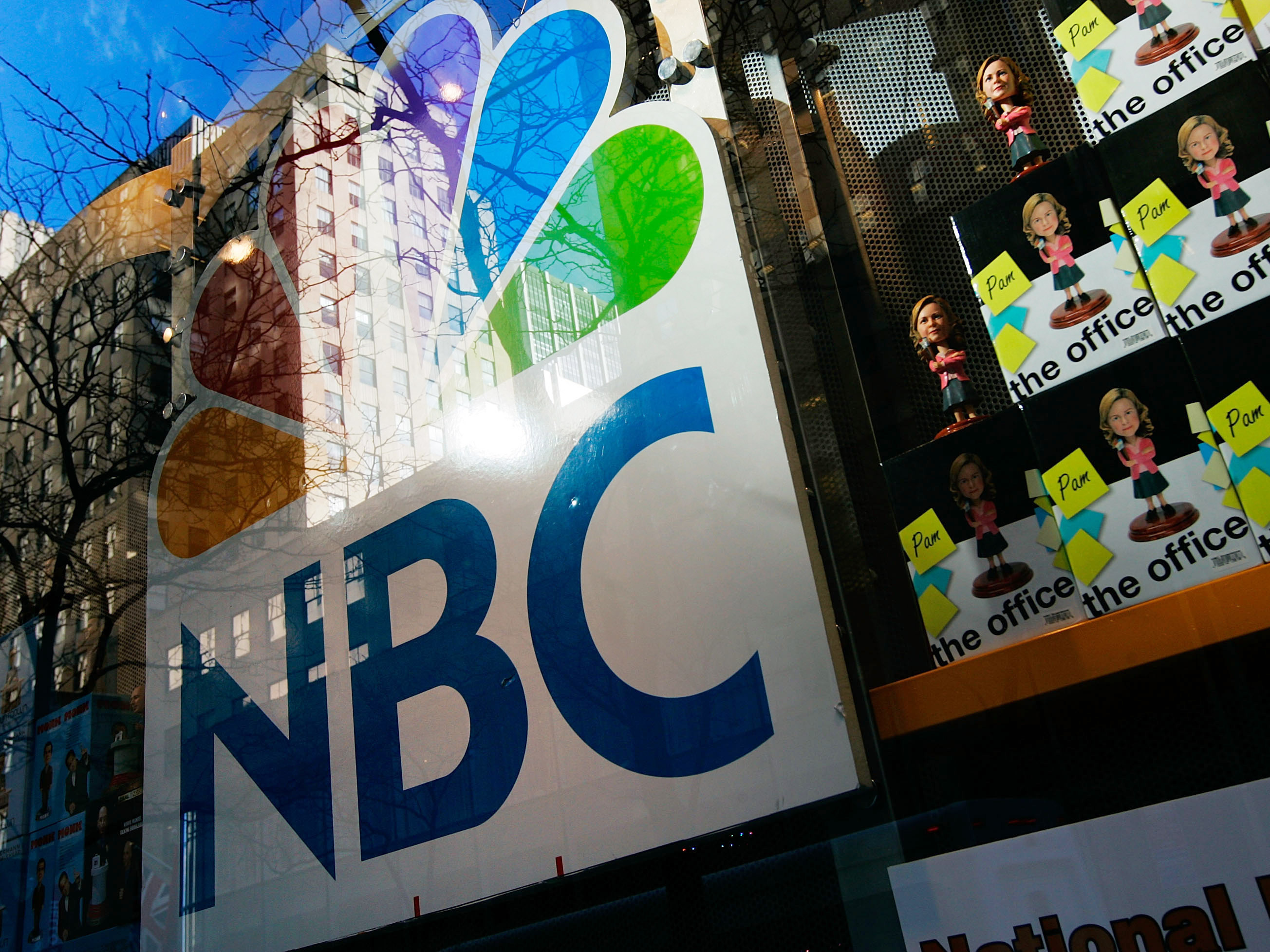 An NBC store is seen through a window reflecting Rockefeller Center in New York City. Comcast, the nation's largest cable company, has owned 51 percent of NBCUniversal since 2011. Comcast To Finish Buying NBCUniversal For $16.7 Billion