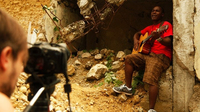 Singer-songwriter Amos Dolce on the set of the video for his song "Haiti, Haiti," which Konbit Mizik produced.