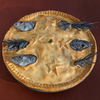 Stargazy Pie, a cornish dish named for the way the fish heads poke through the crust towards the sky. Stargazy Pie, a cornish dish named for the way the fish heads poke through the crust towards the sky.