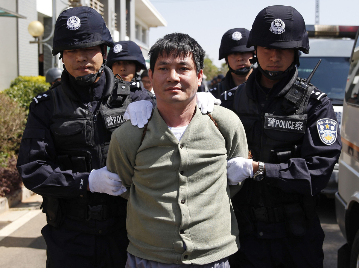 Naw Kham is taken to the execution chambers on Friday.
