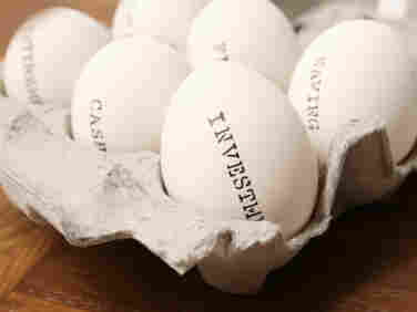 Eggs labeled as cash, investments and savings.