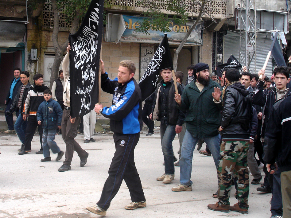 Islamists from Jabhat al Nusra stage their own protest in the town. Until recently, the group has been reluctant to appear in public. (NPR)