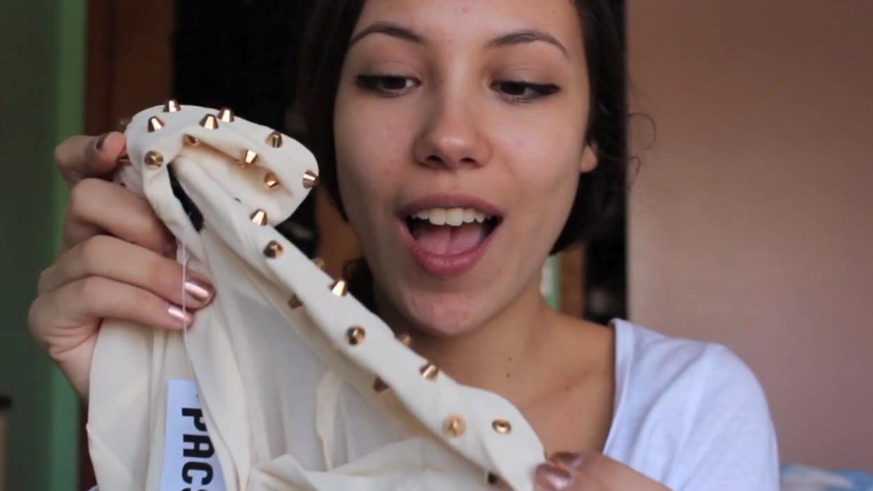 Abigail Moscaritolo holds up a recent fashion find on a &quot;haul video.&quot; The YouTube trend has become so popular that fashion retailers are approaching haulers to promote their products online. (AbbyLynn401/YouTube)
