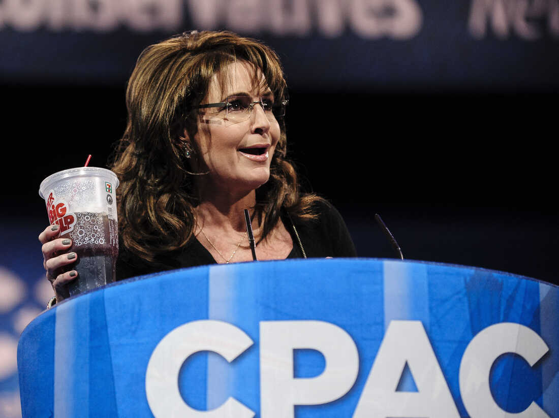 Sarah Palin, former governor of Alaska, holds up a large soda as she speaks about New York City Mayor Michael Bloomberg's proposed large soda ban at the 2013 Conservative Political Action Conference.