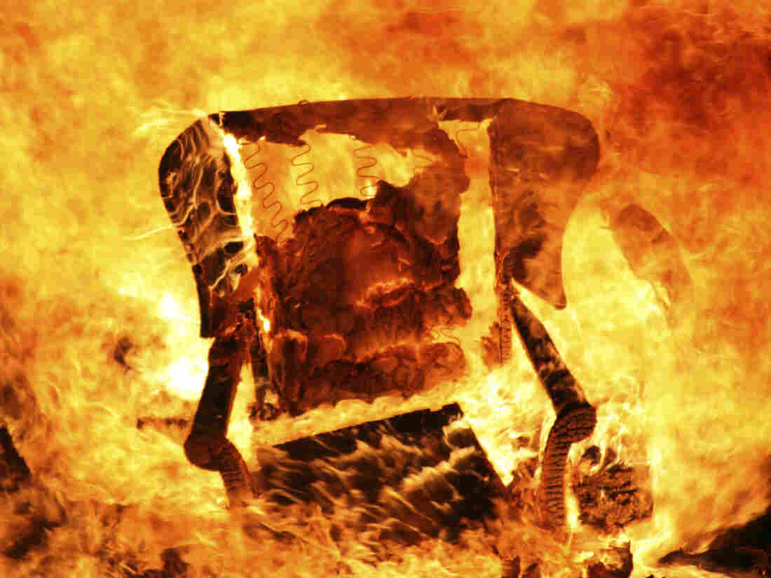 Flames engulf and armchair