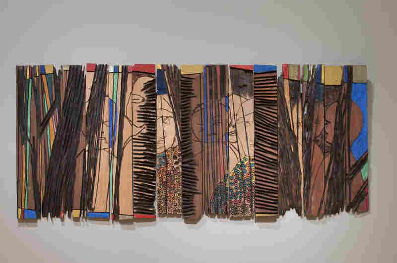 Anatsui's Conspirators (1997) is made up of individual strips of wood that can be arranged differently each time it's installed.