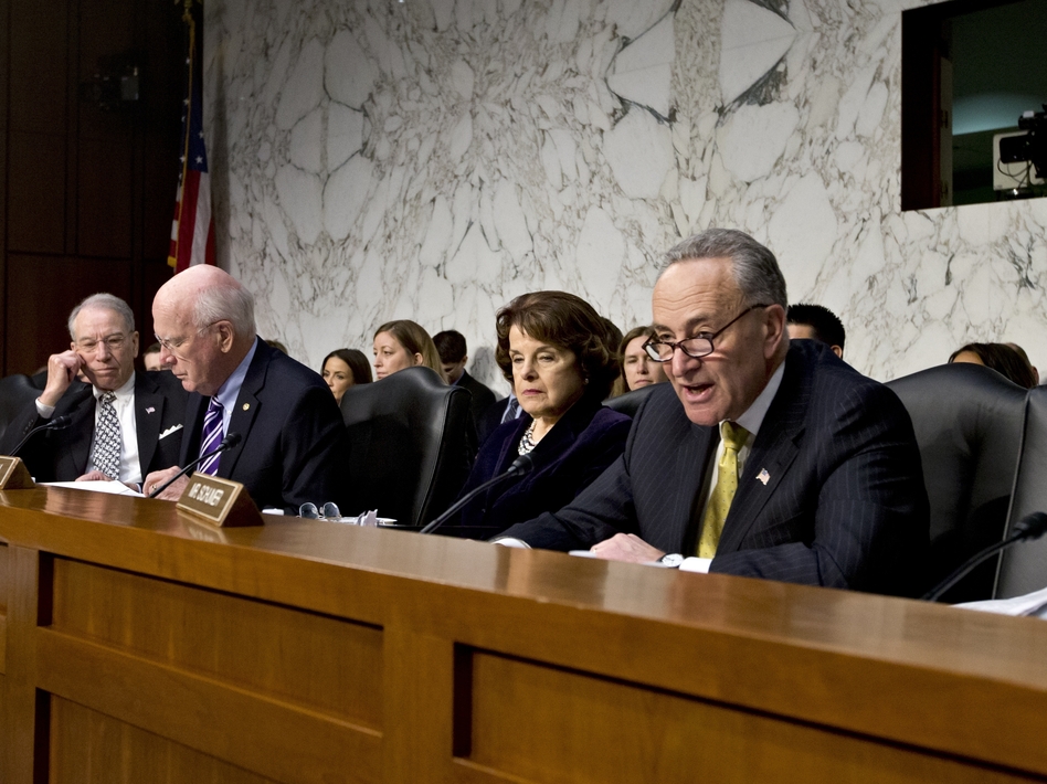 Sen. Chuck Schumer, D-N.Y. (right), talks during a hearing at which he angered Sen. Chuck Grassley, R-Iowa (far left). Grassley thought Schumer was accusing him of using the Boston bombings as an excuse to slow or kill the immigration overhaul. (J. Scott Applewhite/AP)