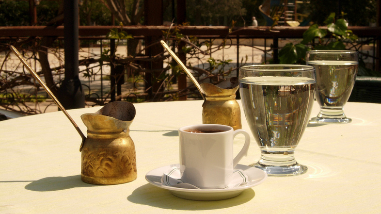 Throughout the region that was once the Ottoman empire, people make coffee pretty much the same way: using coffee beans ground into a fine powder, then boiled in a little brass pot that the Turks call a <em>cezve</em>. (maxpax/via Flickr)