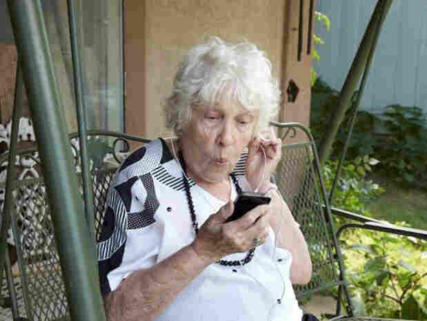 Woman listening to headphones.