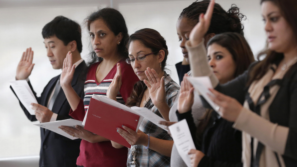 Immigrants take the U.S. oath of citizenship during a naturalization ceremony in Irving, Texas. (LM Otero/AP)