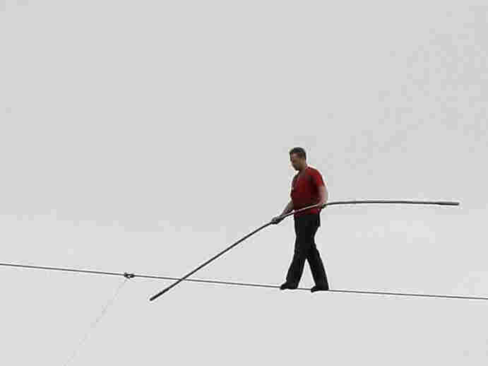 With no net below, Nik Wallenda walks a 1,000-foot-long high wire, suspended 200 feet over the Allegheny River in downtown Pittsburgh in 2009.