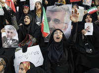 Female supporters of Iranian presidential candidate Saeed Jalili, Iran's top nuclear negotiator, chant slogans at a campaign rally in Tehran on Wednesday, two days ahead of the election.