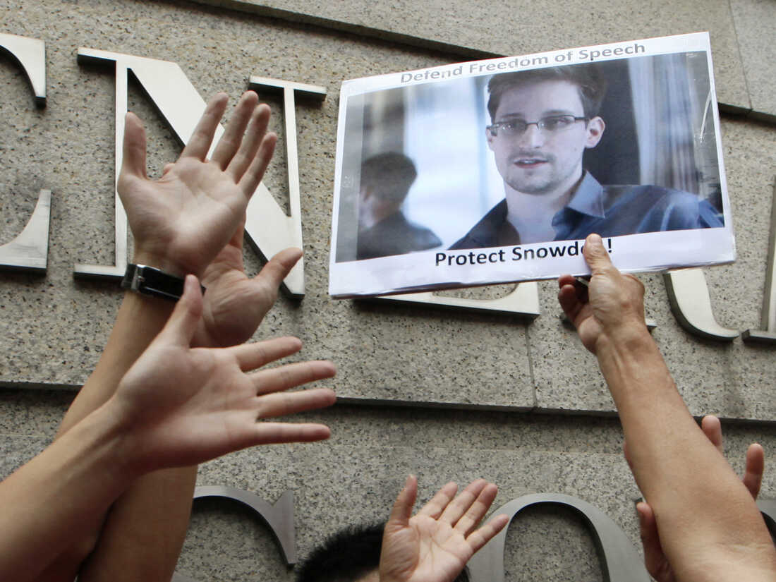 A supporter holds a picture of Edward Snowden, a former CIA employee who leaked top-secret information about U.S. surveillance programs, outside the U.S. Consulate General in Hong Kong on June 13.