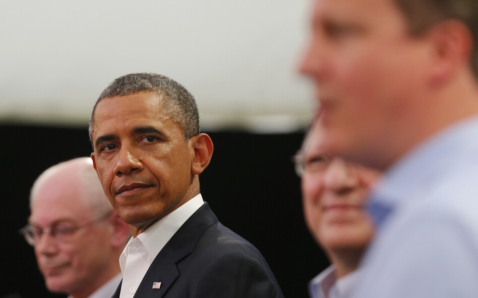 President Obama glances at Britain's Prime Minister David Cameron (right) during a news conference with European Union officials at the G-8 summit in Enniskillen, Northern Ireland, on Monday. (WPA Pool/Getty Images)