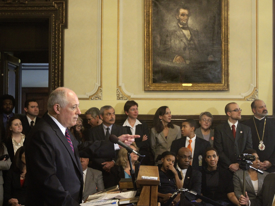 Illinois Gov. Pat Quinn speaks with reporters at the Capitol in 2011 after signing legislation abolishing the death penalty in the state. (Seth Perlman/AP)