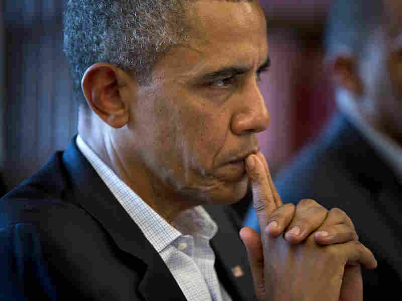President Barack Obama listens to French President Francois Hollande during the G-8 summit in Northern Ireland on Tuesday.