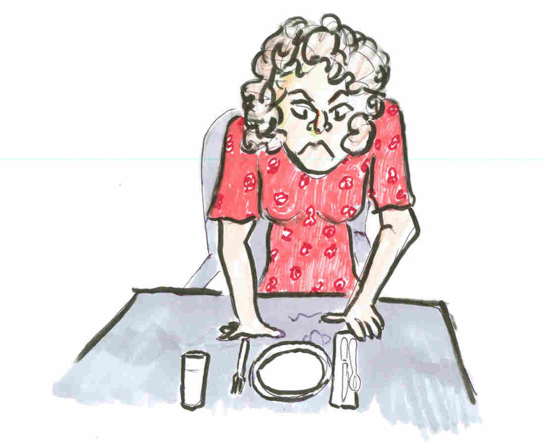 Angry mom at dinner table.