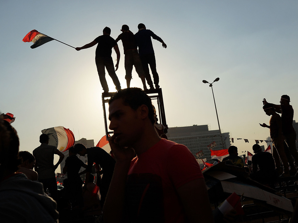 People dance and cheer in Cairo's Tahrir Square on July 4, the day after former Egyptian President Mohammed Morsi was ousted from power. (Spencer Platt/Getty Images)
