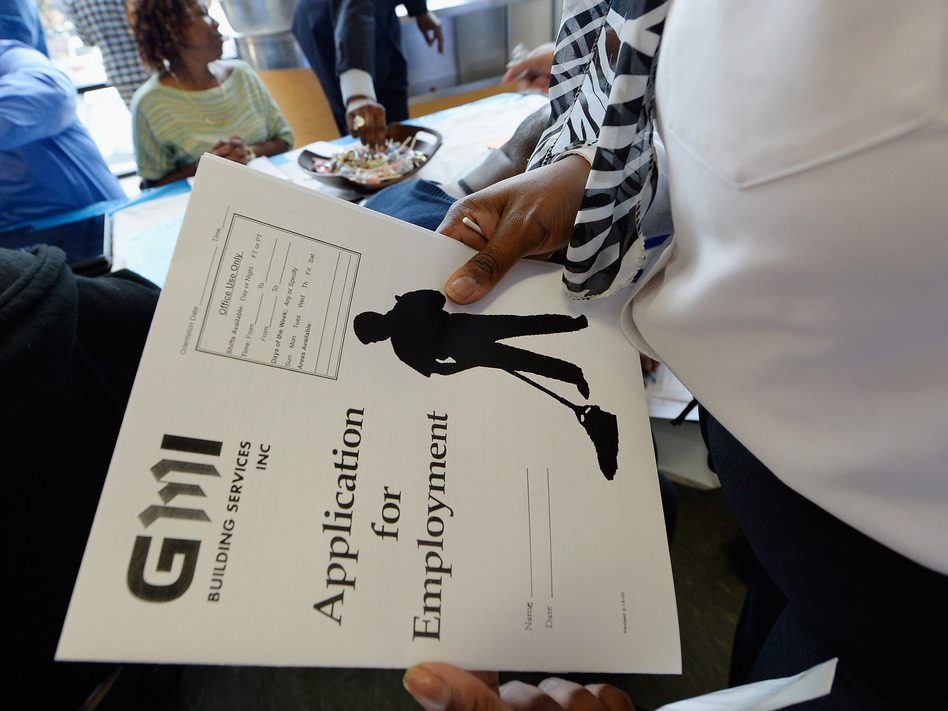 At a job fair in Los Angeles last month, job seekers filled out applications. (Kevork Djansezian/Getty Images)
