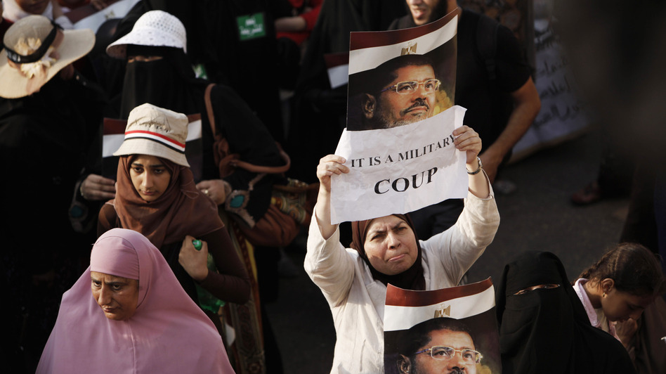 Egypt's military and the nation's interim leaders say the ouster of President Mohammed Morsi was not a coup, but rather a response to public demand. Morsi's supporters believe otherwise. If it was judged to be a coup, the U.S. might have to cut off aid to Egypt's military. (Ed Giles/Getty Images)