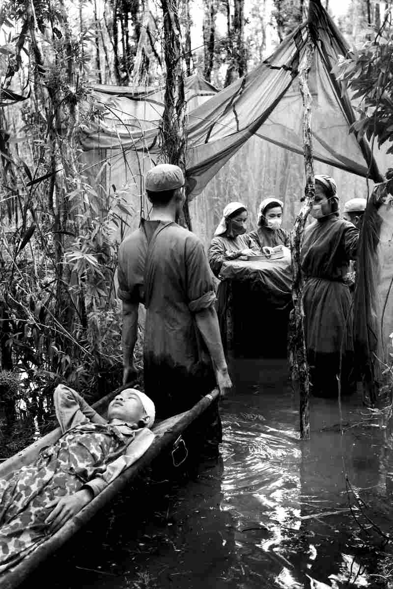 Danh Son Huol, an ethnic Khmer guerrilla, is treated by a medical unit in a swamp in U Minh Forest, Ca Mau peninsula, Vietnam, 1970.