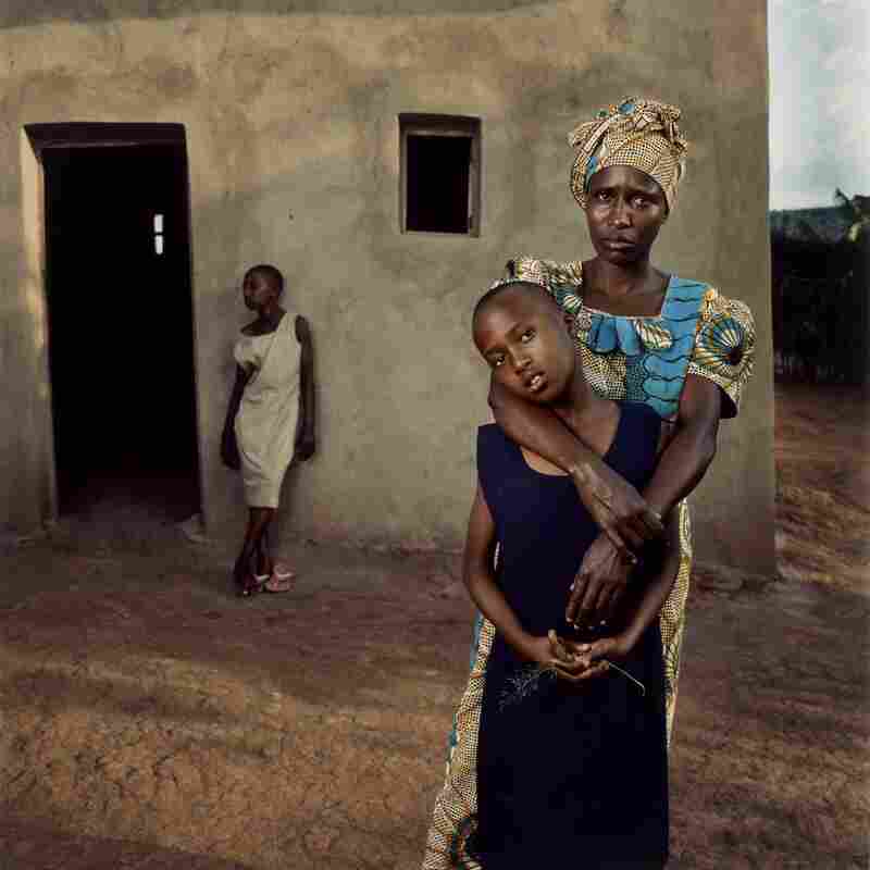 Valentine with her daughters, Amelie and Inez, Rwanda, 2006