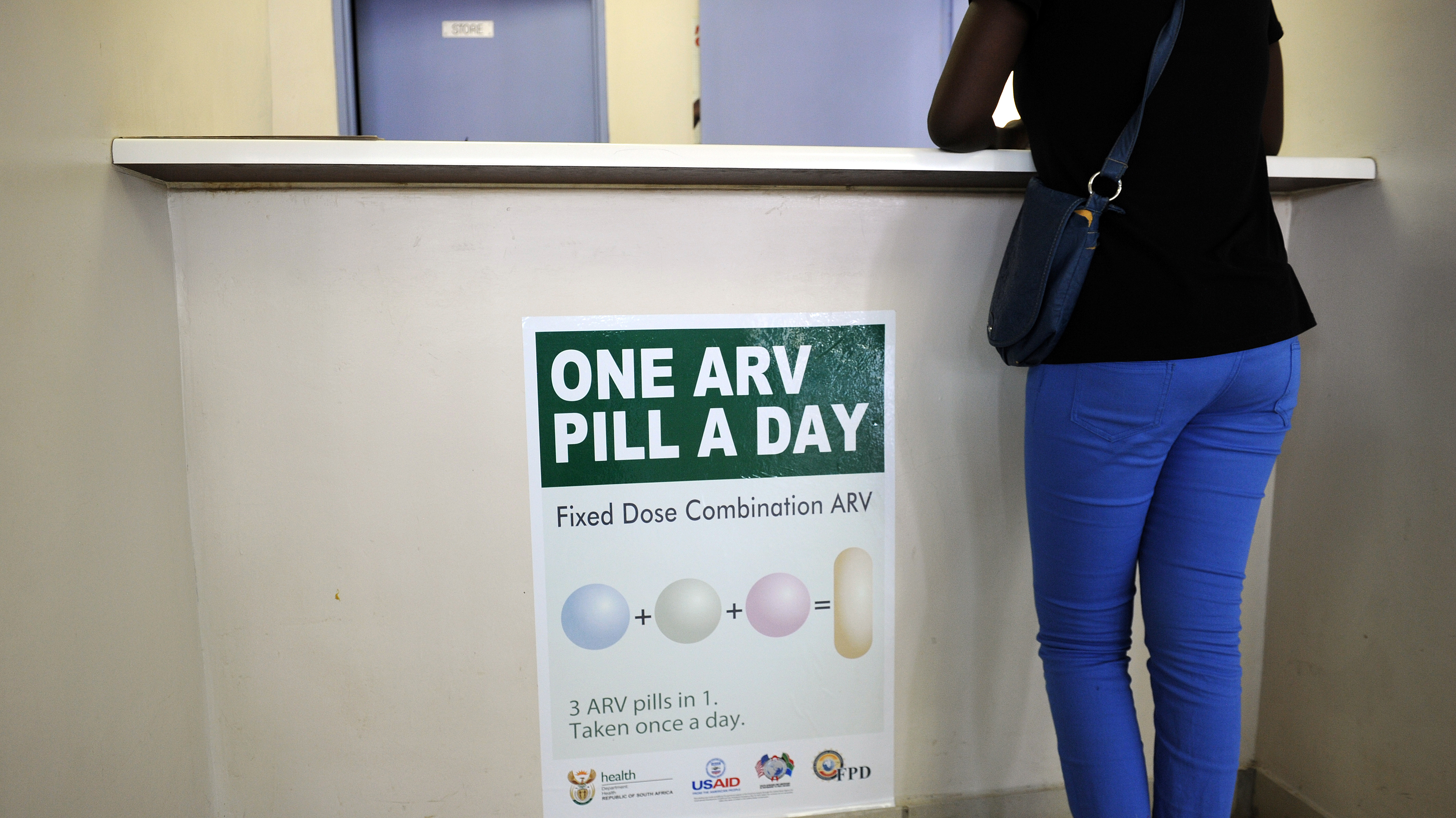 A woman waits to get AIDS drugs on April 8 at a clinic in Ga-Rankuwa, South Africa, about 55 miles north of Johannesburg. New WHO guidelines say patients should start HIV treatment much earlier, before they become extremely sick. (AFP/Getty Images)