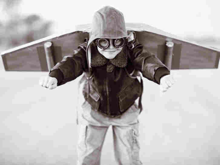 A boy prepares with his jetpack.