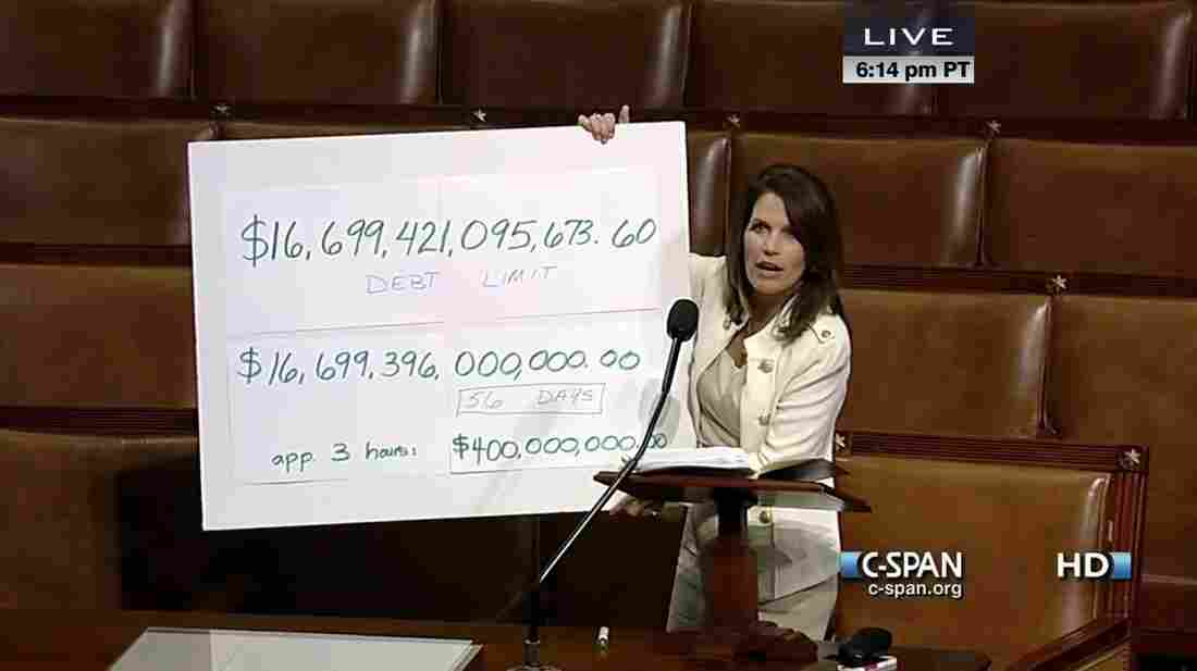 Rep. Michele Bachmann (R-Minn.) holding a floor chart without the help of an easel.