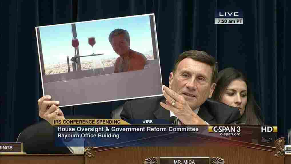 Rep. John Mica (R-Fla.) with a photo poster at a hearing.
