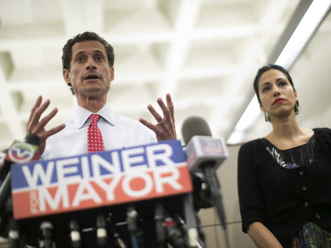 New York mayoral candidate Anthony Weiner, with his wife, Huma Abedin, at his side, says he will stay in the race despite admitting he sent newly revealed sexually explicit online chats and photos even after he resigned from Congress.