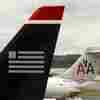 Justice Sues To Block US Airways-American Airlines Merger