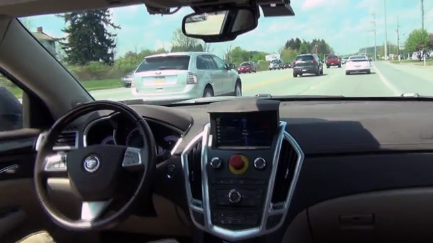 Carnegie Mellon's autonomous car, developed with General Motors, is by all appearances a normal Cadillac SRX crossover — except for the big red button in the middle of the dashboard. In an emergency, the button allows the car to be switched immediately back to standard driving mode. (GM-Carnegie Mellon Autonomous Driving Collaborative Research Lab)