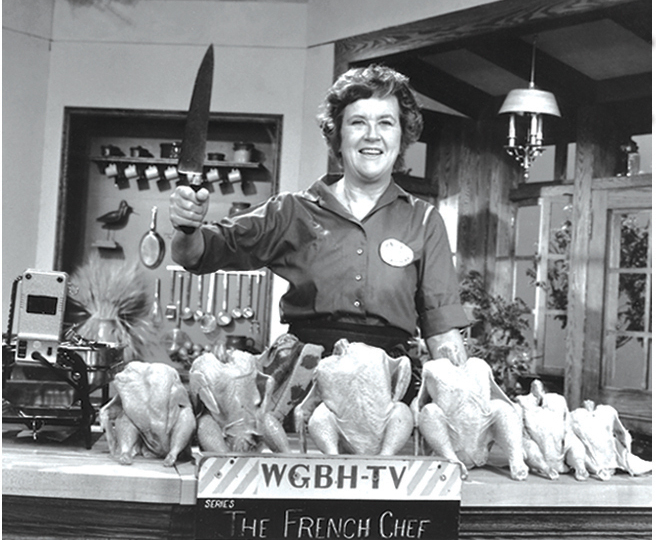 Julia Child poses with &quot;the chicken sisters&quot; before an episode of <em>The French Chef</em> in which she teaches us how to roast a bird. (Courtesy of Paul Child/PBS)