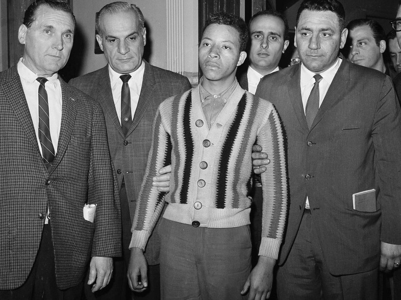 George Whitmore Jr., a 19-year-old unemployed laborer, is shown in a Brooklyn, N.Y., police station on April 25, 1964, after his arrest in the Career Girl Murders. (Jack Kanthal/AP)
